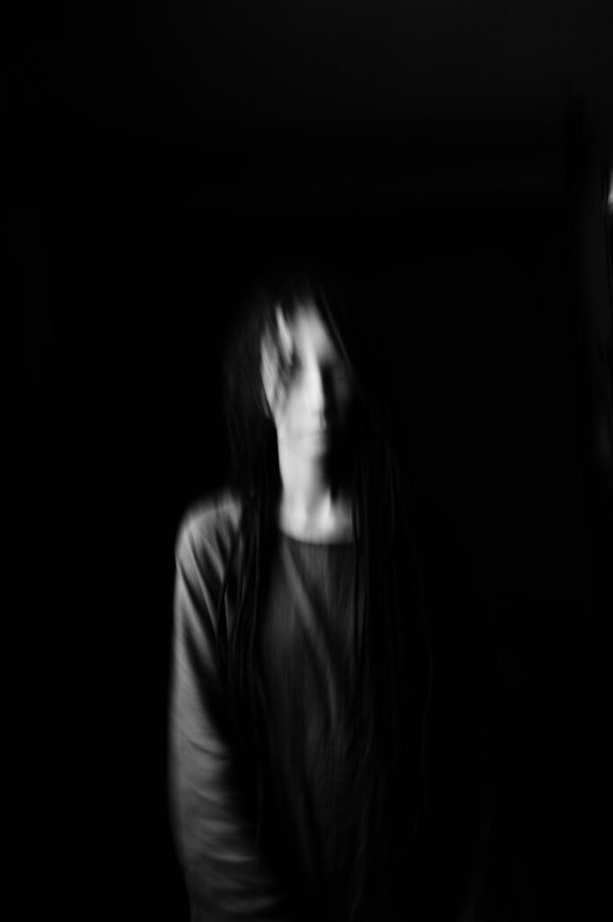 blurry photo of a person in grayscale photography